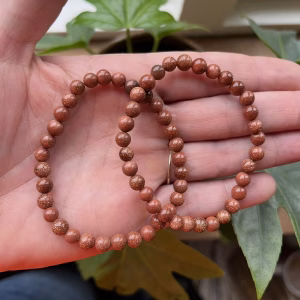 Goudsteen armband met warme glinstering en diepe kleur, Goudsteen armband kopen – stijlvolle edelsteen sieraden, Goudsteen werking – betekenis en gebruik van deze sprankelende armband, Kristallen armband met glinsterende goudsteen steentjes