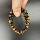 Tijgeroog trio armband 8 mm met bruine, rode en blauwe edelsteen kralen, Spirituele armband tijgeroog trio 8 mm voor bescherming en balans, Natuurlijke tijgeroog armband 8 mm in drie kleuren voor kracht en rust, Edelsteen armband tijgeroog trio 8 mm kopen voor energie en focus, Tijgeroog trio armband 8 mm die moed, kalmte en stabiliteit versterkt, Spirituele sieraden tijgeroog armband 8 mm met driekleurige werking