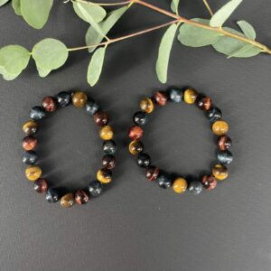 Tijgeroog drie kleuren armband met bruine, rode en blauwe edelsteen kralen, Spirituele armband tijgeroog drie kleuren voor bescherming en balans, Natuurlijke tijgeroog armband in drie kleuren die kracht en rust geeft, Edelsteen armband tijgeroog drie kleuren kopen voor energie en focus, Tijgeroog armband met bruine, rode en blauwe stenen voor moed en kalmte, Spirituele sieraden tijgeroog drie kleuren armband voor aarding en harmonie