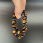Tijgeroog drie kleuren armband met bruine, rode en blauwe edelsteen kralen, Spirituele armband tijgeroog drie kleuren voor bescherming en balans, Natuurlijke tijgeroog armband in drie kleuren die kracht en rust geeft, Edelsteen armband tijgeroog drie kleuren kopen voor energie en focus, Tijgeroog armband met bruine, rode en blauwe stenen voor moed en kalmte, Spirituele sieraden tijgeroog drie kleuren armband voor aarding en harmonie